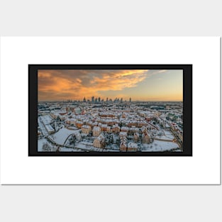 Warsaw old town, snow-covered roofs and and distant city center at dusk Posters and Art